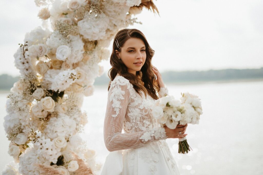 Bridal hairstyle featuring classic Hollywood waves with a side part, perfect for elegant wedding looks.